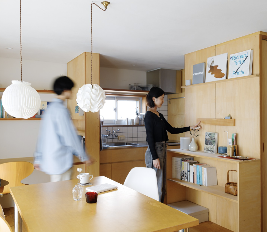 Two People Standing in Kitchen