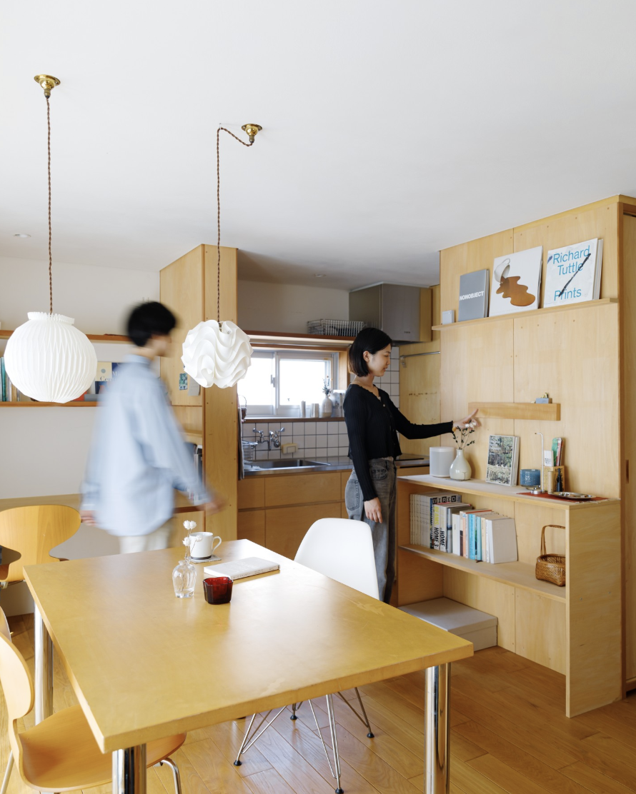 Two People Standing in Kitchen