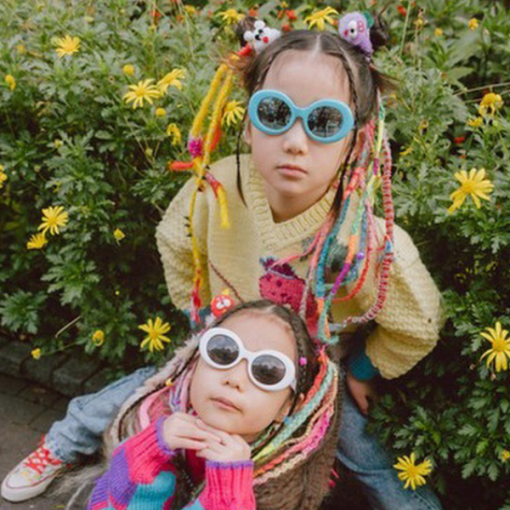 Two little girls playing dress up