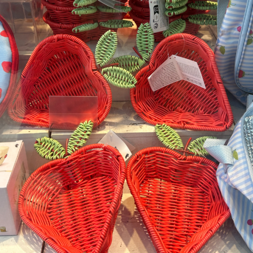four strawberry shaped wicker baskets