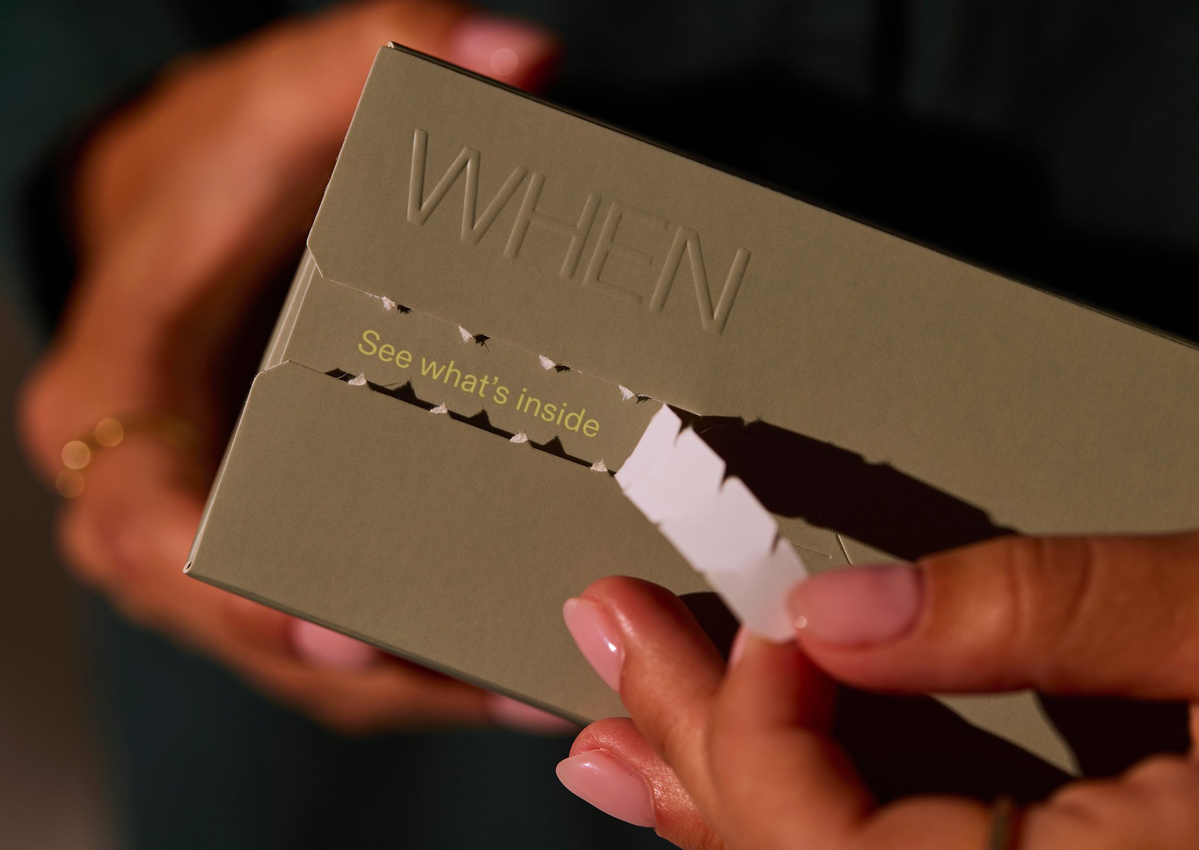 Green Cardboard box in woman's hands