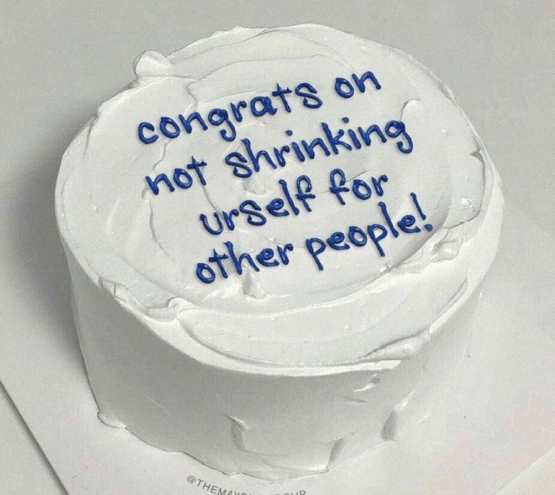 White celebration cake with blue writing