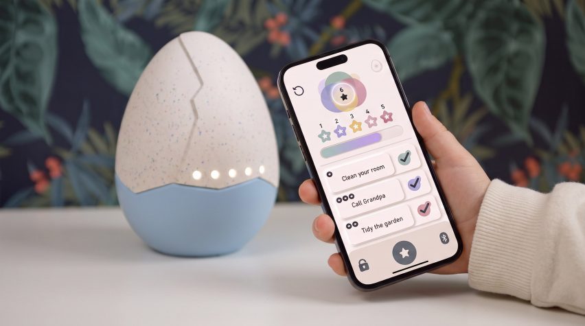 Children's toy in shape of egg alongside application on phone
